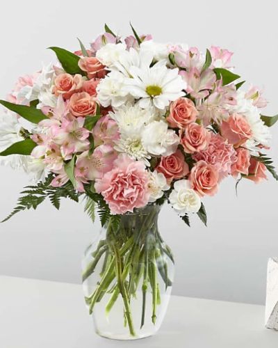 It's just, a little blush! Whoever you're sending this bouquet to, your loved ones are sure to crush hard on these gorgeous pink and white shades.
<ul>
<li>Our florists hand-design each arrangement, so colors, varieties and container may vary due to local availability</li>
</ul>