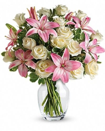 <div class="m-pdp-tabs-description">
<div id="mark-3" class="m-pdp-tabs-marketing-description">A romantic gift like this one is always appreciated. An eye-catching display of roses and lilies is perfectly arranged in a feminine vase which makes a beautiful and lasting impression.</div>
</div>
Elegant white roses and sweet pink asiatic lilies are hand-arranged with greens. It's the perfect way to show you love them always and forever.
<ul>
<li>Our florists hand-design each arrangement, so colors, varieties and containers may vary due to local availability</li>
</ul>