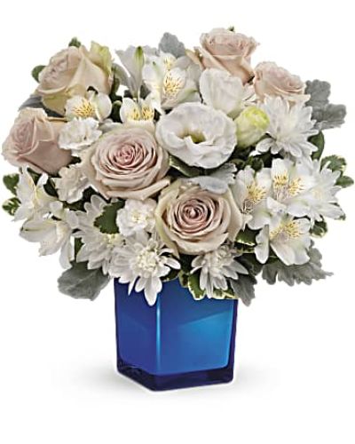 <div id="mark-3" class="m-pdp-tabs-marketing-description">Bursting with gorgeous roses and blooms, this cobalt or clear glass cube vase is a gorgeous gift that can also serve as a beautiful candleholder!</div>
<div id="desc-3">This splendid bouquet features crème roses, white cushion spray chrysanthemums, white lisianthus, white alstroemeria, miniature white carnations, dusty miller and variegated pittosporum.
<ul>
<li>Our florists hand-design each arrangement, so colors, varieties and containers may vary due to local availability</li>
</ul>
</div>
