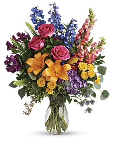 <div id="mark-3" class="m-pdp-tabs-marketing-description">A rainbow of beauty for any occasion. Purple hydrangea, pink roses and orange lilies positively pop in this bright bouquet, featuring all the colors of the rainbow.</div>
<div id="desc-3">
<ul>
<li>This colorful bouquet includes purple hydrangea, pink roses, yellow spray roses, orange asiatic lilies, purple alstroemeria, blue delphinium, pink snapdragons, blue eryngium, huckleberry, oregonia, Israeli ruscus, sword fern, silver dollar eucalyptus, seeded eucalyptus, and lemon leaf.</li>
<li>Our florists hand-design each arrangement, so colors, varieties and containers may vary due to local availability</li>
</ul>
</div>
