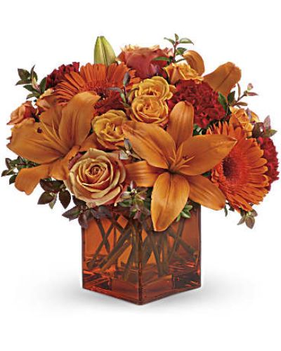 <div id="mark-3" class="m-pdp-tabs-marketing-description">Celebrate the wonder of a new day with warm, golden flowers. A modern orange glass vase is the foundation of this stunning, sun-bright bouquet that energizes any occasion</div>
<ul>
<li>Orange gerbera daisies, orange roses and red mini carnations are accented with a spray of red huckleberry in a cube vase</li>
<li>Our florists hand-design each arrangement, so colors, varieties and containers may vary due to local availability</li>
</ul>
<div id="desc-3"></div>