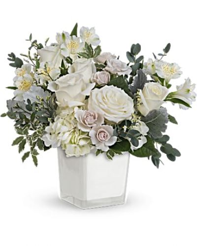 <div id="mark-3" class="m-pdp-tabs-marketing-description">As serene as soft white clouds floating in a crisp blue sky, this elegant white rose bouquet in a simple glass cube brings peace and beauty to any occasion.</div>
<div id="desc-3">
This peaceful arrangement includes white hydrangea, white roses, white spray roses, white alstroemeria, dusty miller, white limonium, parvifolia eucalyptus and pitta Negra.
<ul>
<li>Our florists hand-design each arrangement, so colors, varieties and container may vary due to local availability</li>
</ul>
</div>