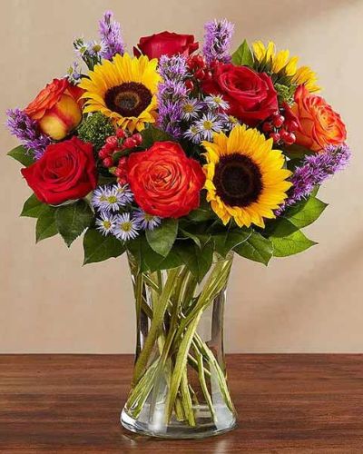 Bring the serene beauty of autumn to someone you care about with our country-inspired arrangement. Filled with a medley of fresh-picked blooms in brilliant colors, it’s a gift that’s sure to surprise & delight.
<ul>
<li>Our florists hand-design each arrangement, so colors, varieties and containers may vary due to local availability</li>
</ul>