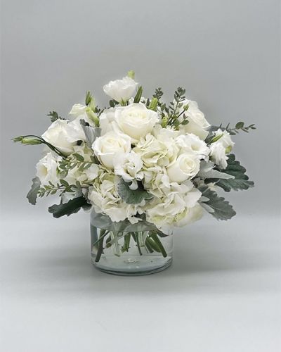 If you're looking for the perfect gift in a dazzling array of white flowers, then look no further as this arrangement is guaranteed to turn heads and make your recipient smile.
<ul>
<li>Our florists hand-design each arrangement, so colors, varieties and container may vary due to local availability</li>
</ul>