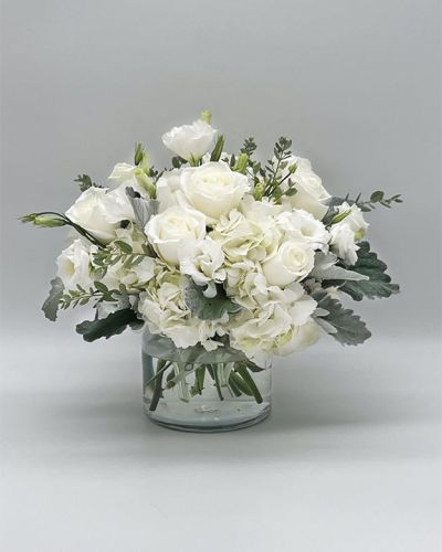 If you're looking for the perfect gift in a dazzling array of white flowers, then look no further as this arrangement is guaranteed to turn heads and make your recipient smile.
<ul>
<li>Our florists hand-design each arrangement, so colors, varieties and container may vary due to local availability</li>
</ul>