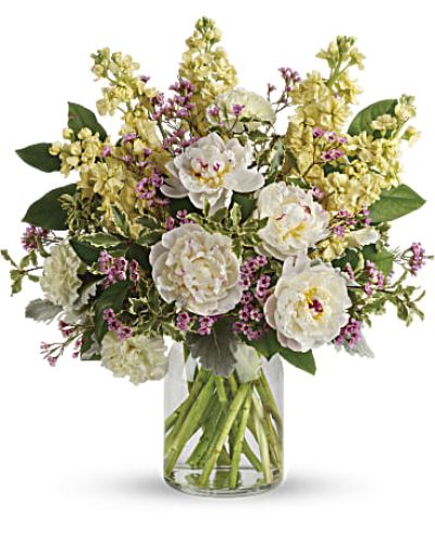 <div id="mark-3" class="m-pdp-tabs-marketing-description">Chic and serene, this dreamy bouquet of wondrous white peonies and creamy blooms in a milk jug vase sends your very best wishes for a stylish spring!</div>
<div id="desc-3">
<ul>
<li>This serene arrangement features white peonies, light yellow carnations, light yellow stock, lavender waxflower, dusty miller, pitta negra, and lemon leaf.</li>
<li>Delivered in a clear glass vase.</li>
<li>Our florists hand-design each arrangement, so colors, varieties and containers may vary due to local availability</li>
</ul>
</div>