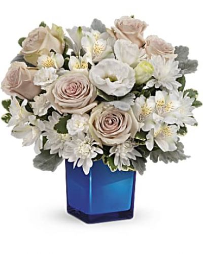 <div id="mark-3" class="m-pdp-tabs-marketing-description">Bursting with gorgeous roses and blooms, this cobalt or clear glass cube vase is a gorgeous gift that can also serve as a beautiful candleholder!</div>
<div id="desc-3">This splendid bouquet features crème roses, white cushion spray chrysanthemums, white lisianthus, white alstroemeria, miniature white carnations, dusty miller and variegated pittosporum.
<ul>
<li>Our florists hand-design each arrangement, so colors, varieties and containers may vary due to local availability</li>
</ul>
</div>
