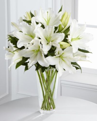 The FTD® Light In Your Honor™ Bouquet is a beautifully bright arrangement bursting with elegant fragrance to convey your deepest sympathies for the loss of their loved one. A stunning bouquet of gorgeous Oriental lilies are accented with lush greens and seated in a clear glass vase to create a bouquet that is serenely sophisticated, offering comfort and peace in their time of need.
<ul>
<li>Our florists hand-design each arrangement, so colors, varieties and containers may vary due to local availability</li>
</ul>